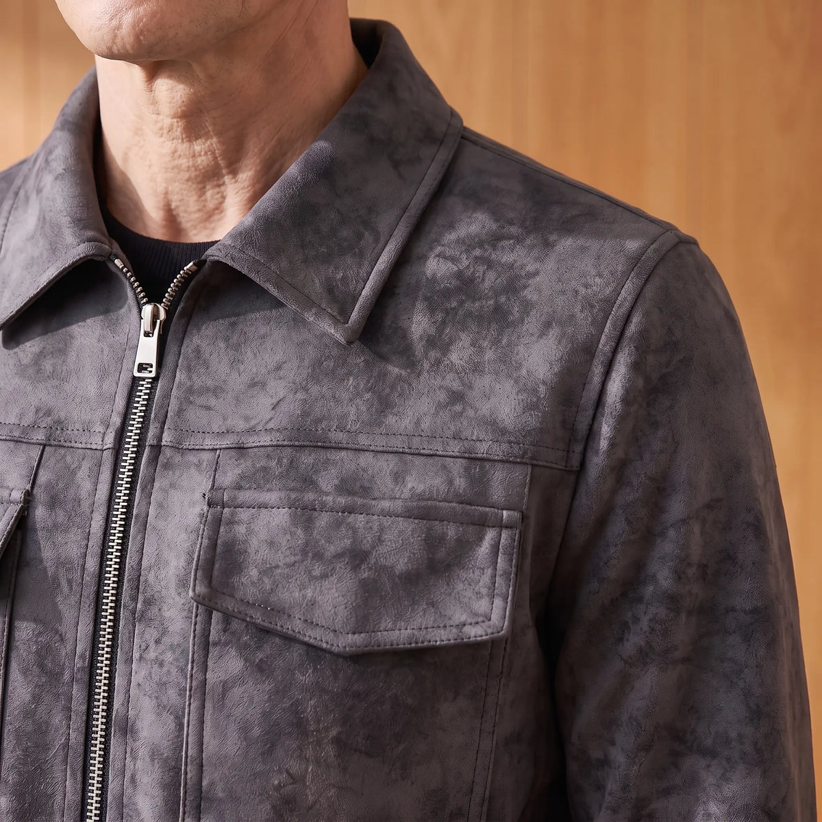 Close-up of the frosted suede jacket collar, zip and flap chest pocket
