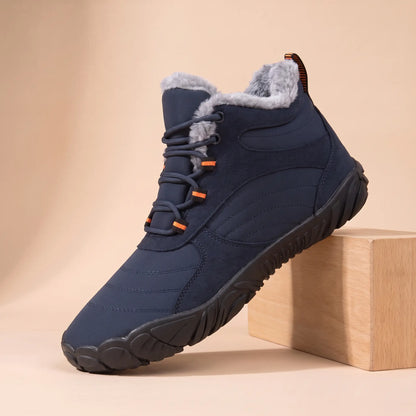 Men's navy blue plush-lined wide toe winter boot on an oak block