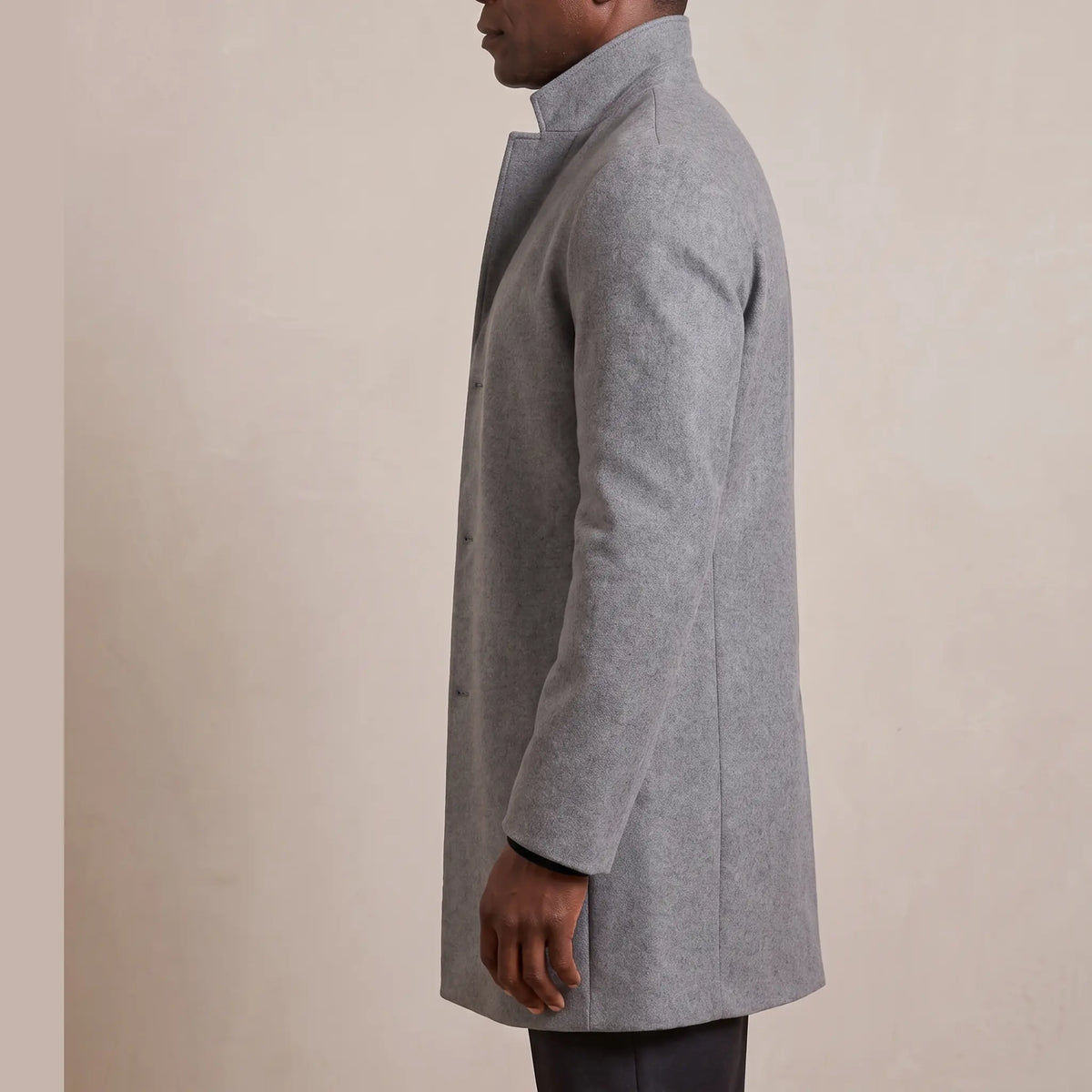 Side profile of the wool overcoat showing how it hangs