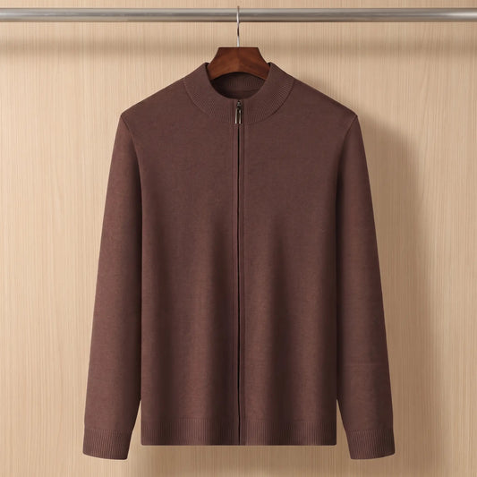 Brown funnel neck zip sweater on a wooden hanger against a chestnut plank wall