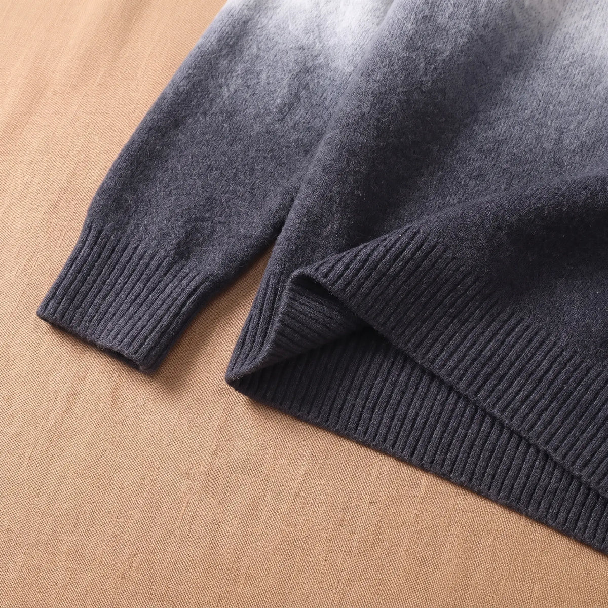 GRADIENT HALF-ZIP SWEATER Grey Cuff Detail - Close-up of the ribbed cuff and hem on the grey ombre half-zip sweater