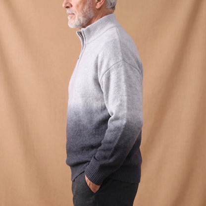 GRADIENT HALF-ZIP SWEATER Grey Side - Side view of a man wearing the grey ombre half-zip sweater with dark trousers