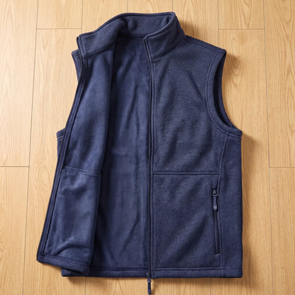 HEATHER FLEECE VEST opened to show the soft fleece inside, navy blue
