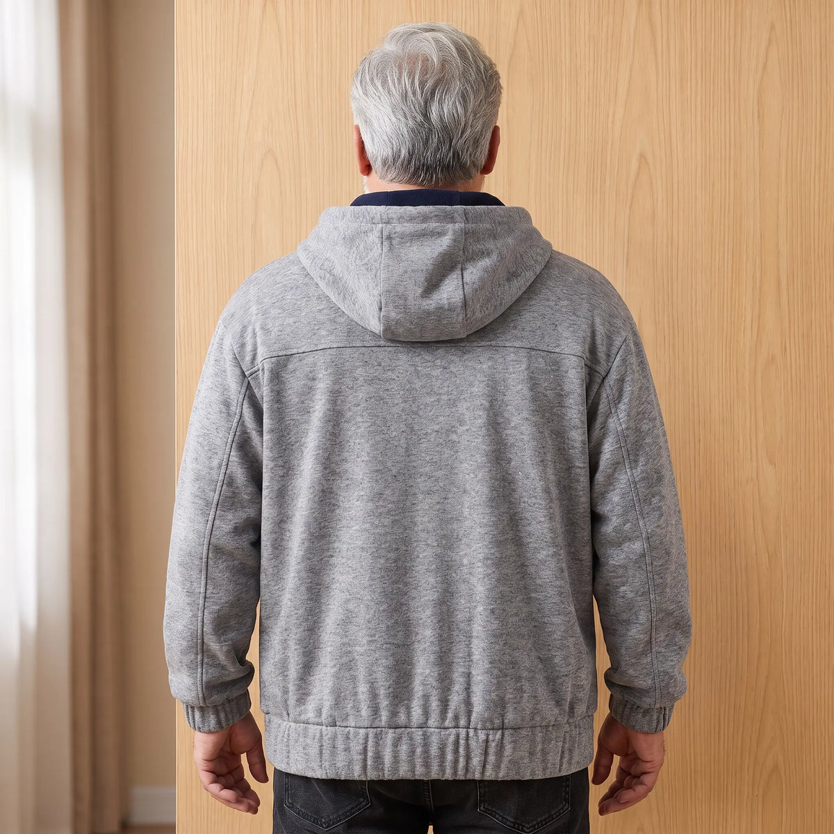 Back view of a man wearing the grey heather half-zip hoodie