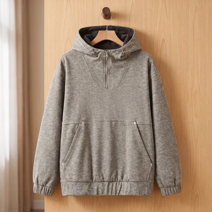 Heather half-zip hoodie in khaki with lined hood on a wooden hanger