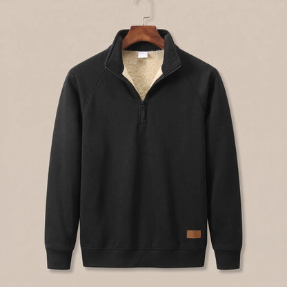 Heather knit sweater in black with sherpa-lined quarter-zip collar, on a wooden hanger