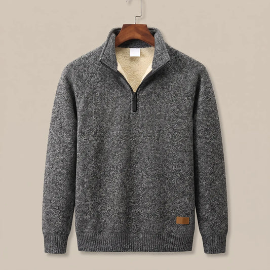 Heather knit sweater in dark grey with sherpa-lined quarter-zip collar, on a wooden hanger