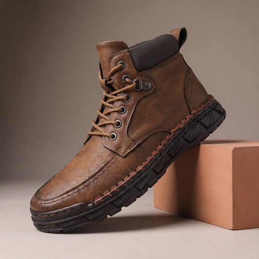 Brown heavy lug moc toe boot on a terracotta display block