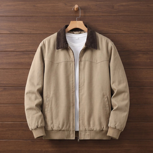 Men's khaki washed canvas work jacket with brown corduroy collar and zip front on a wooden hanger