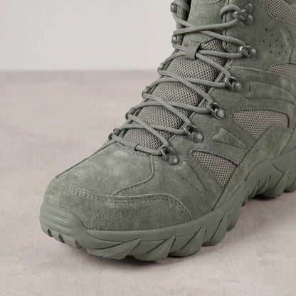 Close-up of the lacing and speed hooks on green high-top tactical boots for men