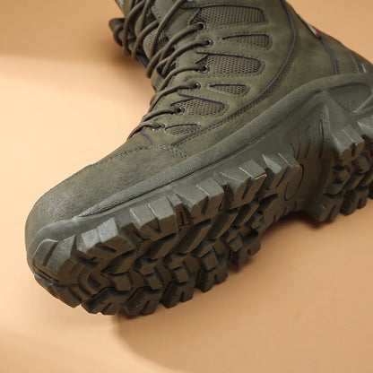 Close-up of the green high lace boot toe and deep lug sole