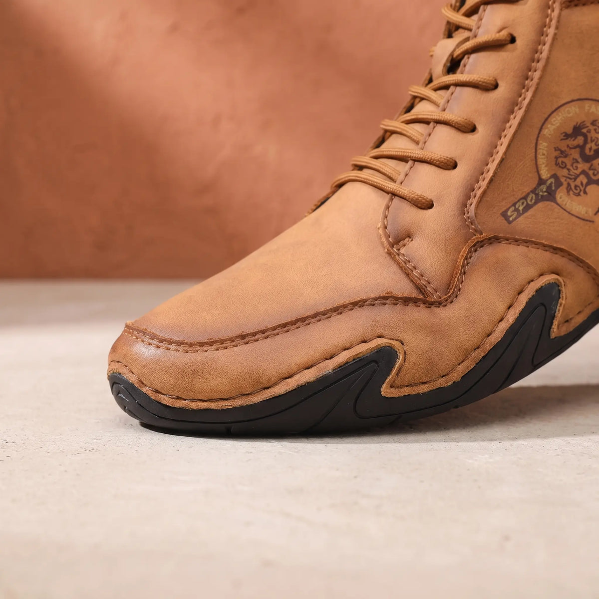 Close-up of the hand-stitched toe and wrap-around sole of the knit collar boot