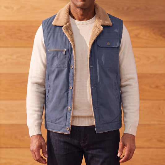 Men's blue lapel collar vest with camel fleece collar, worn over an off-white sweater