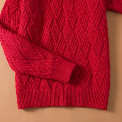 Close-up of the ribbed cuff and hem on the red lattice knit sweater
