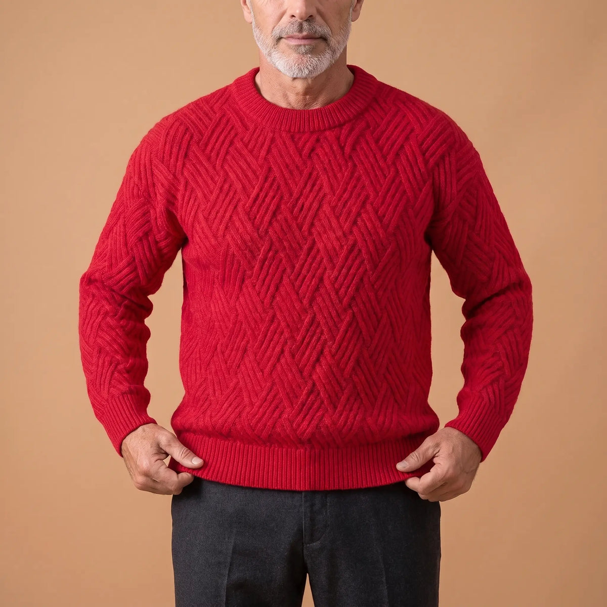 Man straightening the hem of a red lattice knit sweater