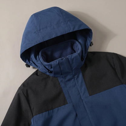 Close up of the hood, stand collar and fleece-lined neck on the navy blue layered hooded jacket