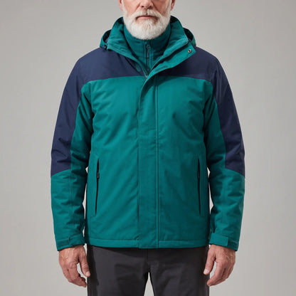 Men's green hooded shell jacket with navy blue shoulder panels and a zip-in fleece, worn zipped