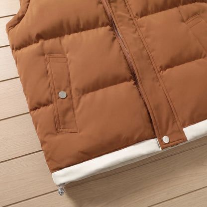 Close up of the LAYERED HOOD VEST snap pocket and contrast hem