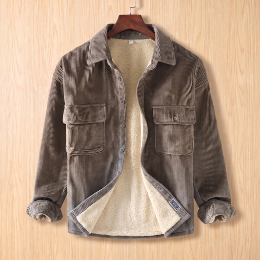 Layering Shirt Jacket in gray, a fleece lined corduroy overshirt with two buttoned chest pockets on a wooden hanger