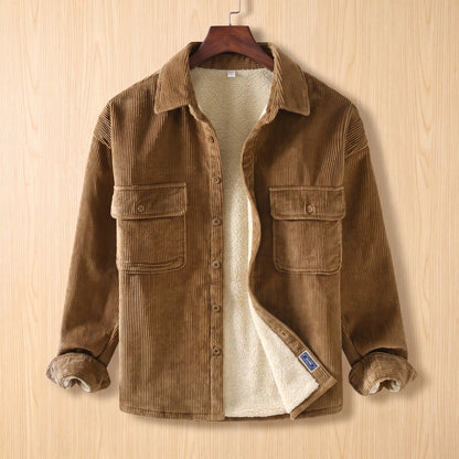 Layering Shirt Jacket in khaki, a fleece lined corduroy overshirt with two buttoned chest pockets on a wooden hanger