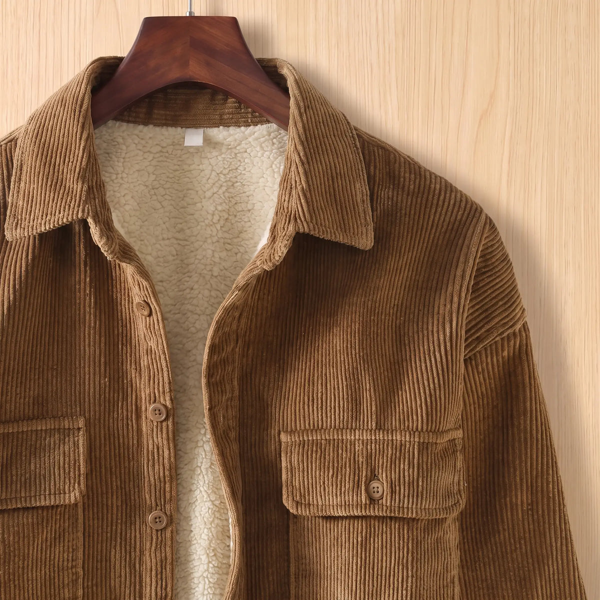 Close up of the collar, button placket, fleece lining and corduroy rib on the khaki Layering Shirt Jacket