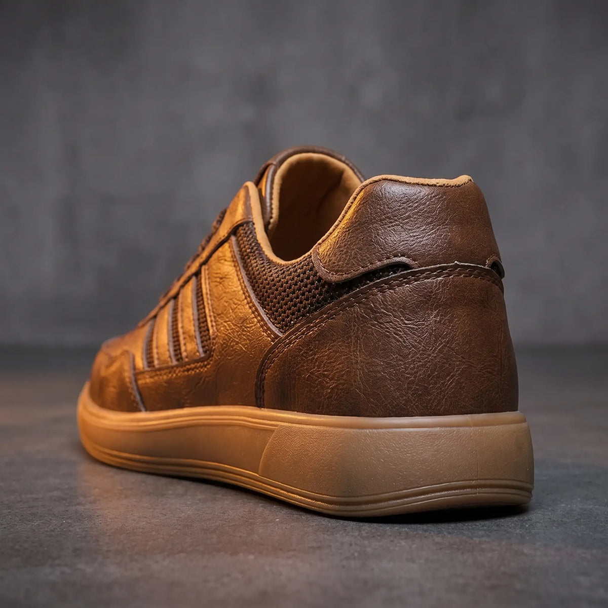Rear close up of brown court sneakers showing the tan lining and gum sole edge