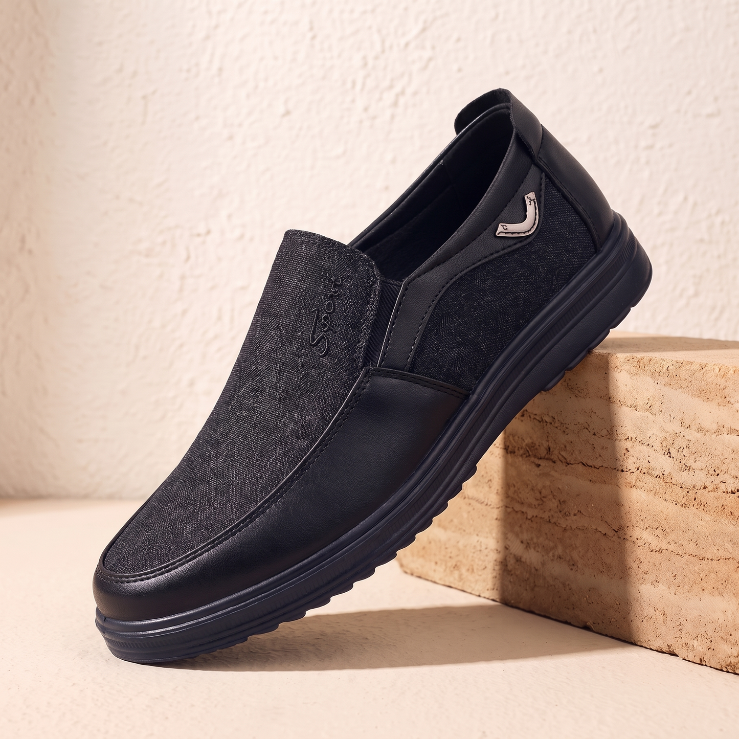 Black canvas and leather slip-on loafer with black cup sole