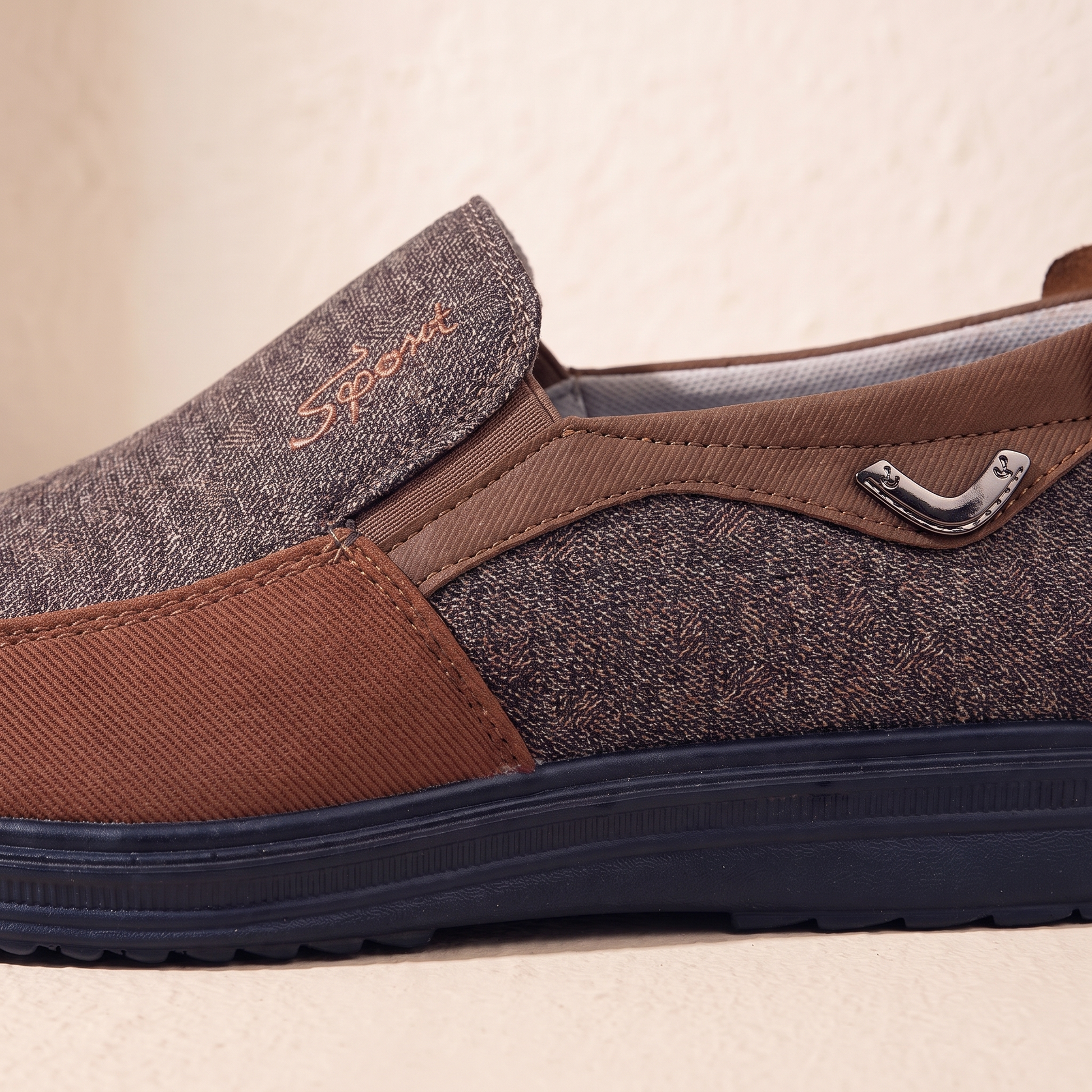 Close-up of the loafer instep, elastic gusset and metal side ornament