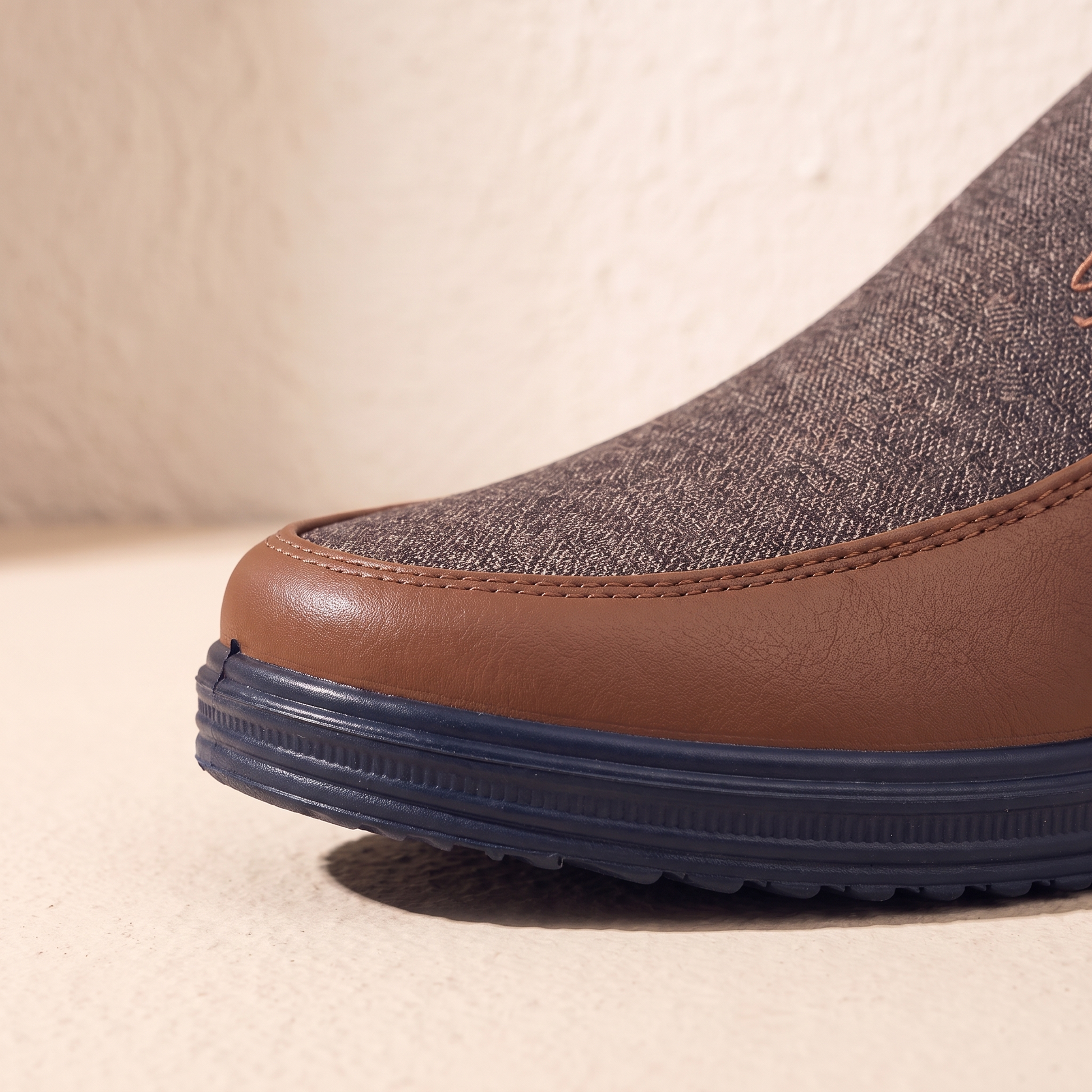 Close-up of the loafer leather toe cap and navy cup sole tread