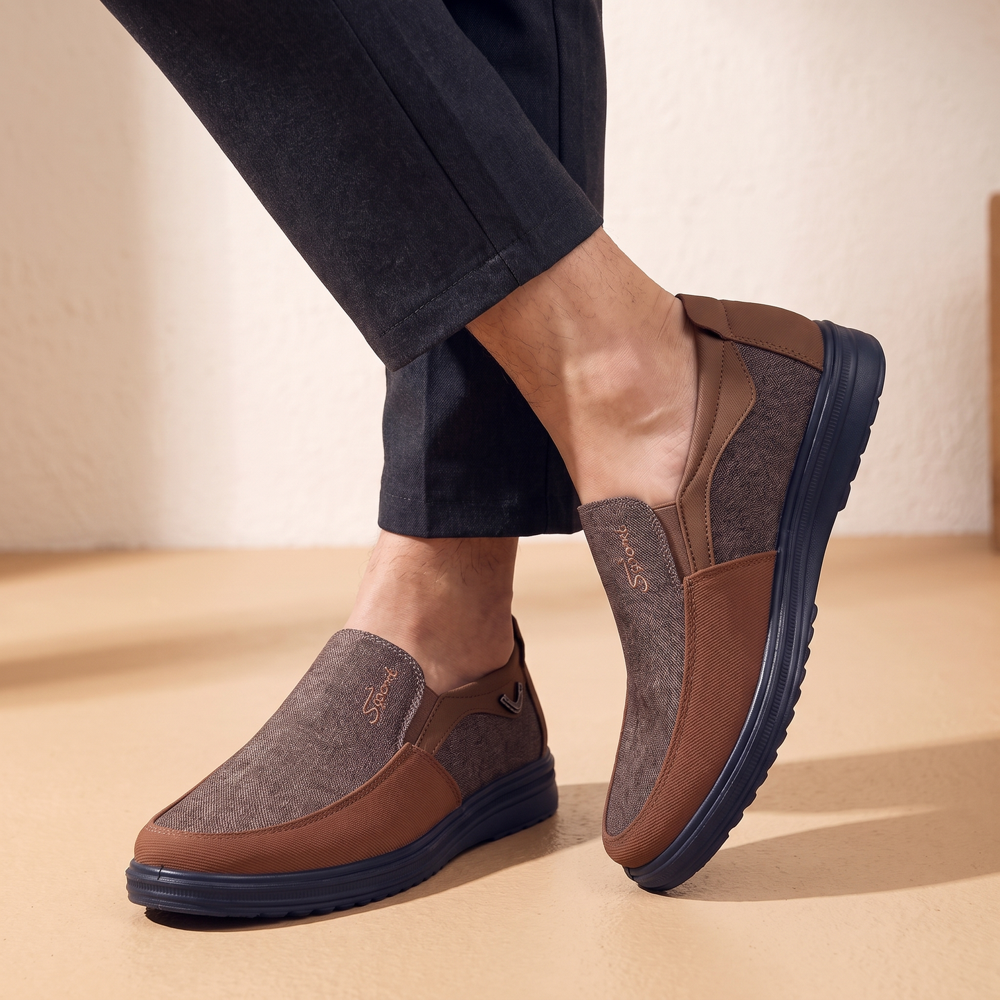 Man standing with ankles crossed wearing the canvas loafers