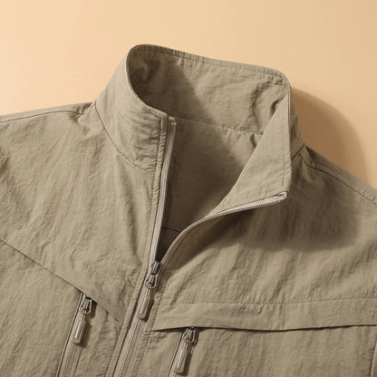 Close-up of the stand collar and zip front on the khaki utility jacket