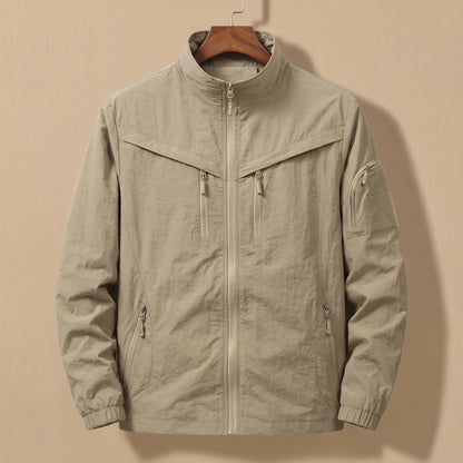 Men's khaki lightweight utility jacket with five zip pockets on a wooden hanger