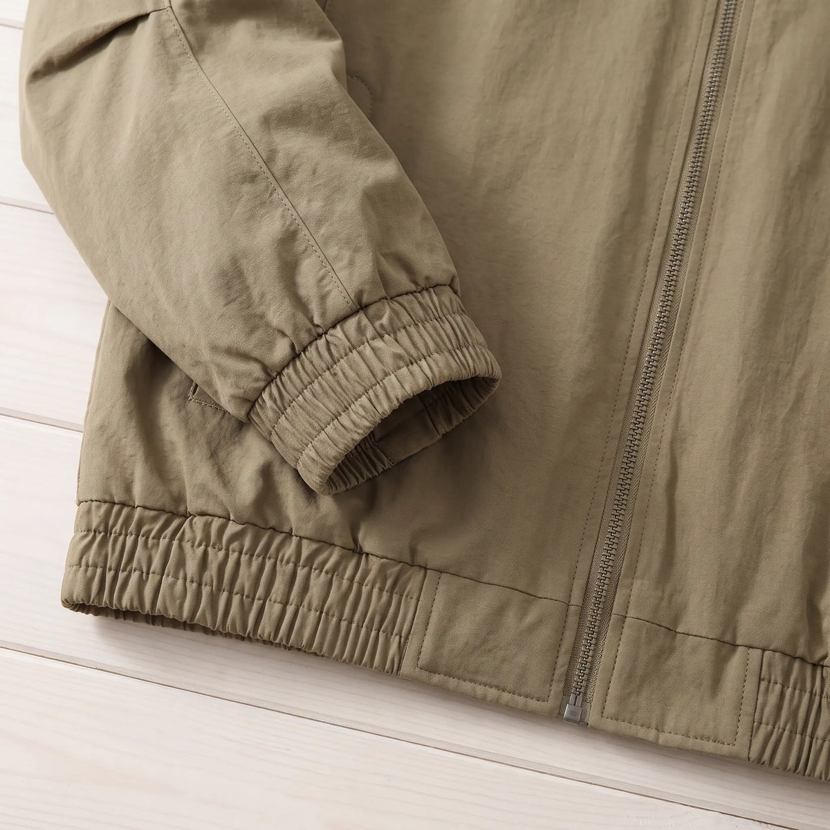 Jacket elastic cuff and hem detail