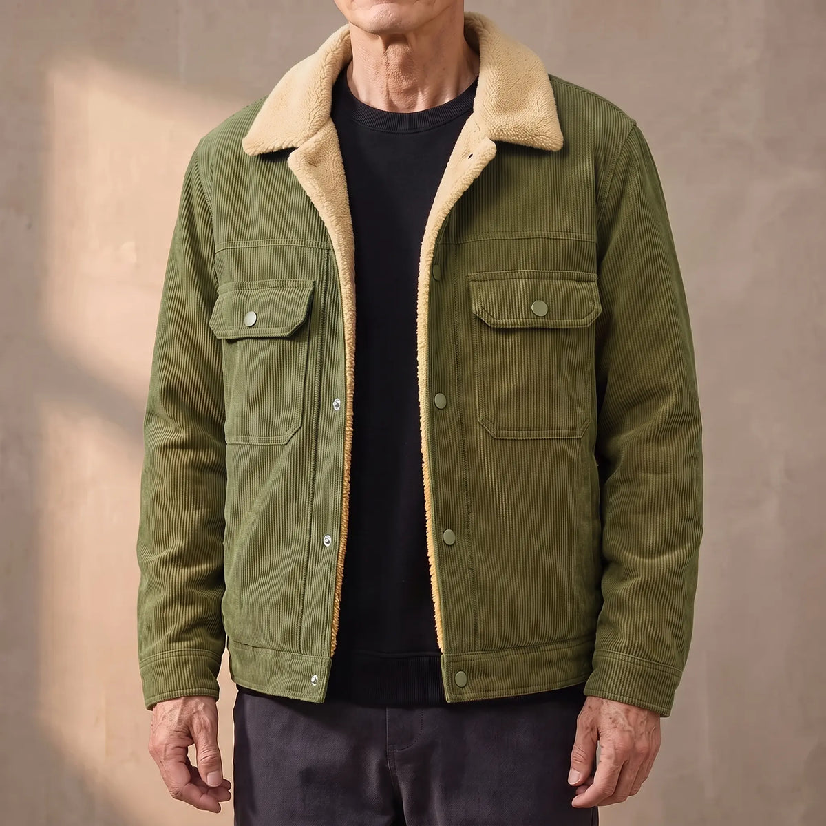Green lined corduroy jacket with sherpa collar worn open by an older man