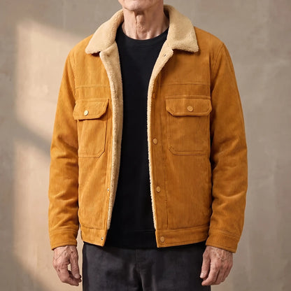 Mustard lined corduroy jacket with sherpa collar worn open by an older man