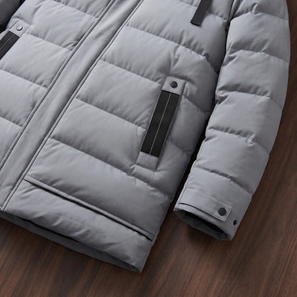 Close up of the side pocket and snap cuff on the grey long puffer coat