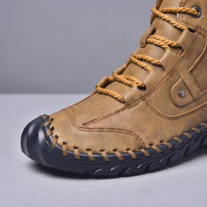 Close-up of the toe, lace loops and hand stitching on the brown men's ankle boot