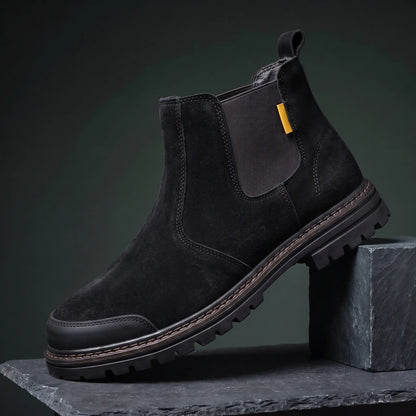 Black slip on work boot with steel toe and lugged rubber sole