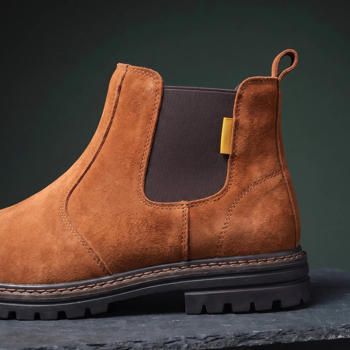 Close up of the elastic side gusset and heel pull tab on the work boot