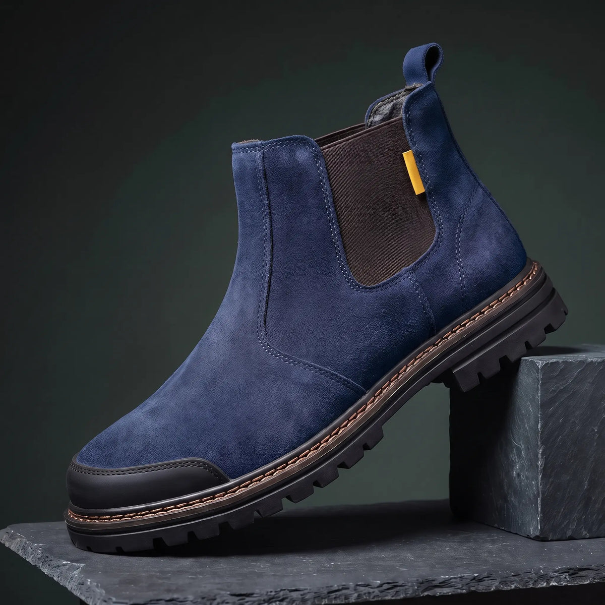 Navy slip on work boot with steel toe and lugged rubber sole