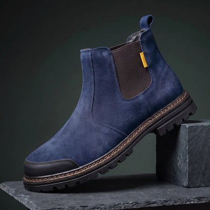 Navy slip on work boot with steel toe and lugged rubber sole