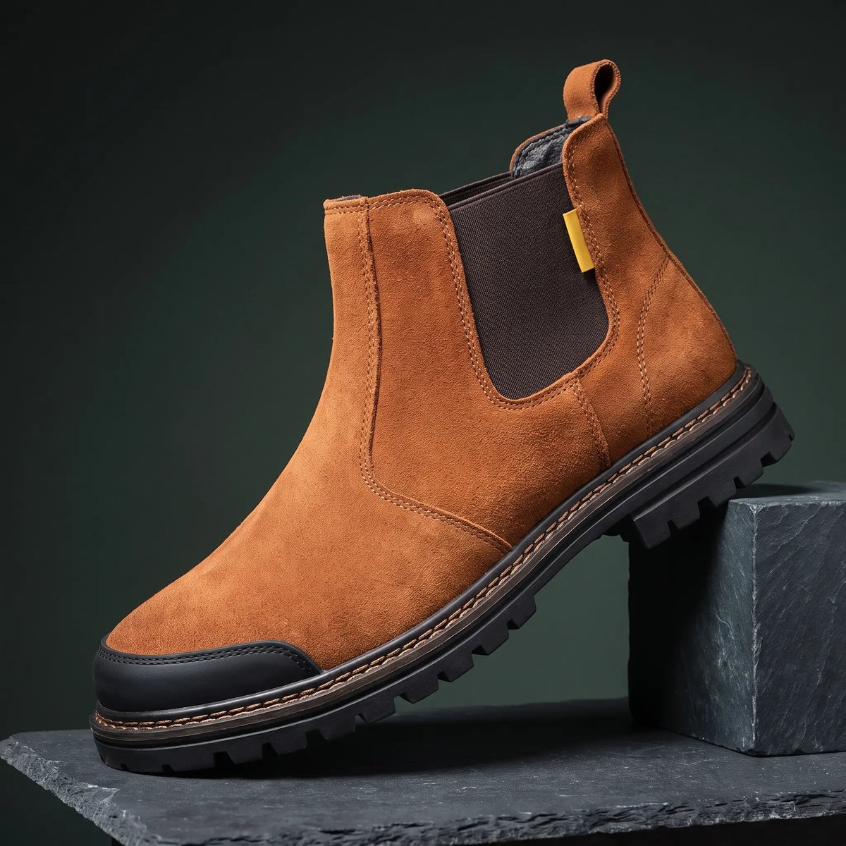 Tan slip on work boot with steel toe and lugged rubber sole