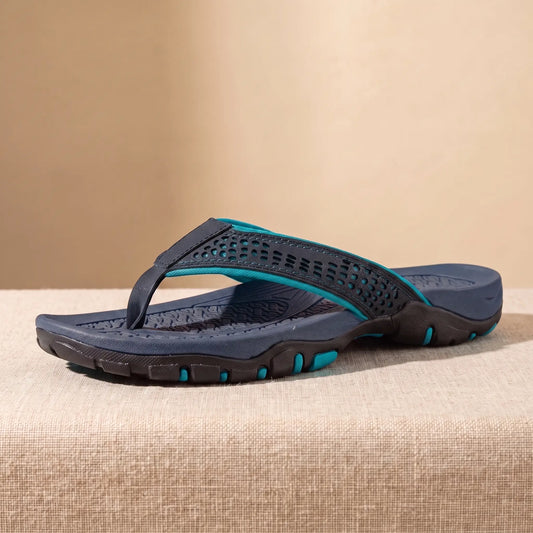 Navy blue mens toe post slipper with cut out strap teal accents and chunky lug tread sole