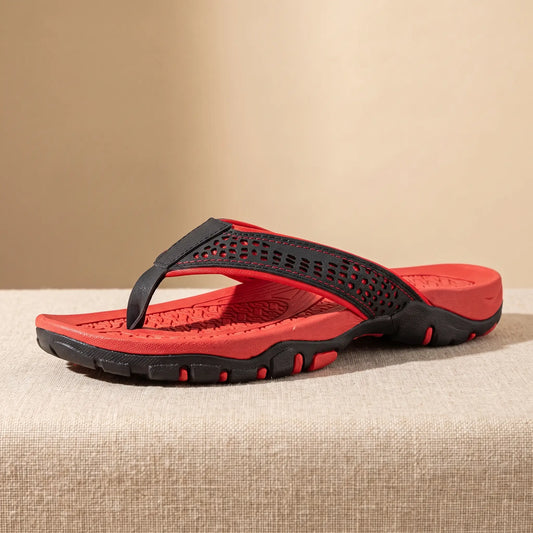 Red mens toe post slipper with black cut out strap and chunky lug tread sole