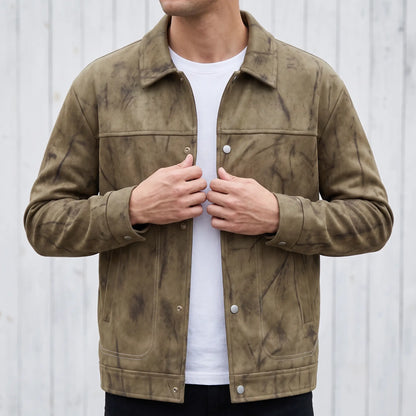 Man wearing the khaki marbled dye trucker jacket and snapping the front closed