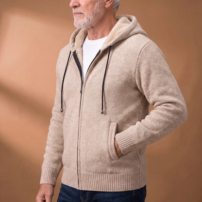 Side view of a man wearing the beige marled knit hoodie