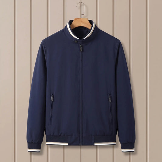 Marlowe tipped stand-collar zip jacket in navy blue on a wooden hanger