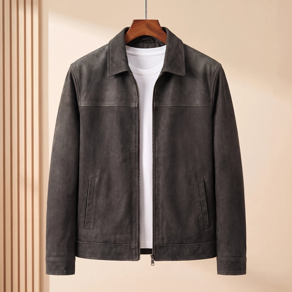 Black matte finish zip front jacket with shirt collar on a wooden hanger