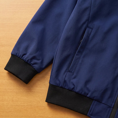 Close detail of MATTE SHELL BOMBER showing the ribbed cuff, zip pocket and hem