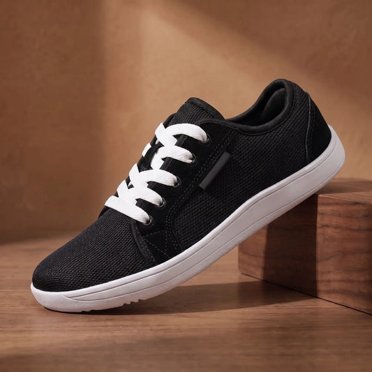 Natural stride sneakers in black with white sole